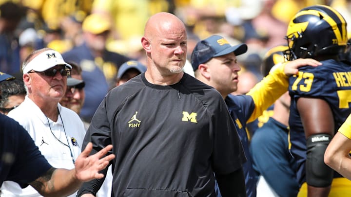 Michigan associate head coach and director of strength and conditioning Ben Herbert watches a play
