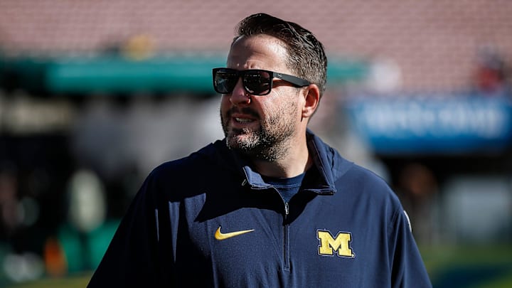 Michigan quarterbacks coach Kirk Campbell watches warmups before the Alabama game at Rose Bowl