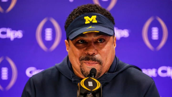 Michigan running backs coach Mike Hart speaks during Media Day at George R. Brown Convention Center