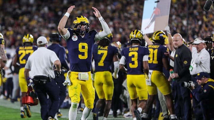 Michigan quarterback J.J. McCarthy celebrates a play against Alabama during overtime of the Rose
