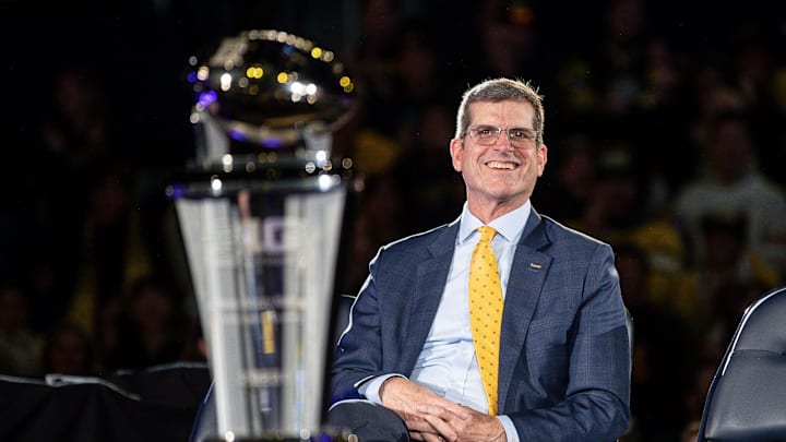 Jim Harbaugh looks on during Michigan's national championship celebration.