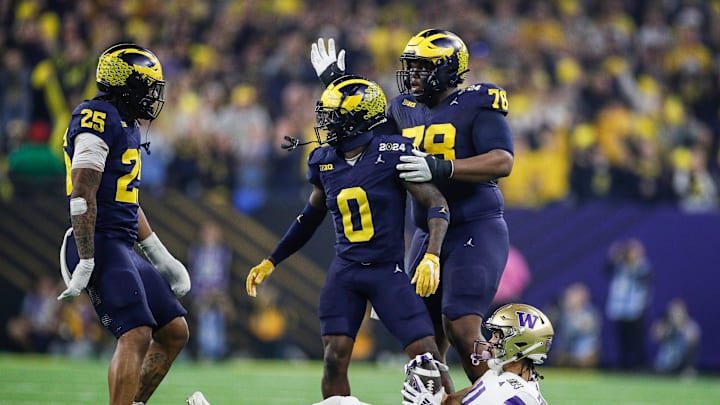 Michigan defensive back Mike Sainristil celebrates a play against Washington during the first half