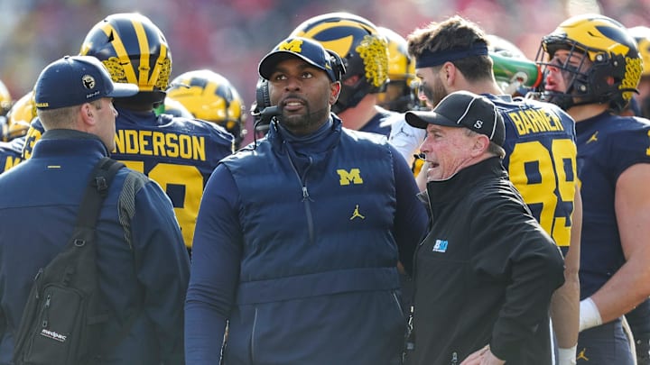 Michigan acting head coach Sherrone Moore watches a replay during the first half against Ohio State at Michigan Stadium in Ann Arbor on Saturday, Nov. 25, 2023.