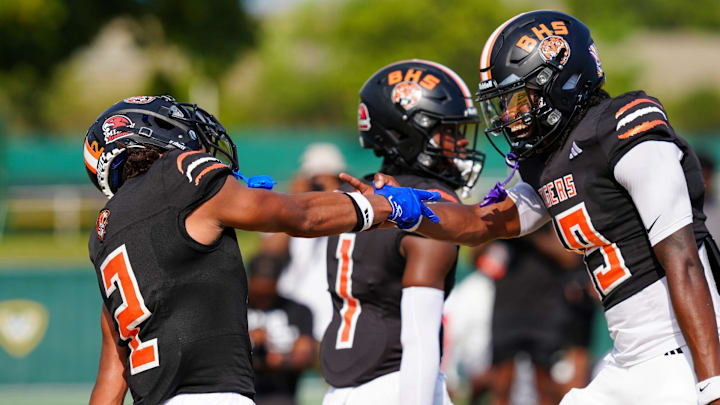 Belleville's Adrian Walker Jr. celebrates with Bryce Underwood after Walker made a touchdown against Clarkston during the 2024 Xenith Prep Kickoff Classic at Wayne State's Tom Adams Field in Detroit on Friday, Aug. 30, 2024.