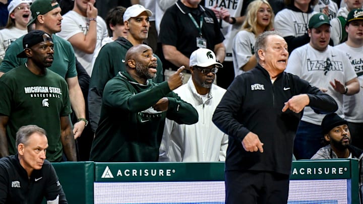 From left, former Michigan State players Jason Richardson, Mateen Cleaves, former assistant coach Mike Garland and Mo Peterson, sit behind Tom Izzo during the second half in the game against Oregon on Saturday, Feb. 8, 2025, at the Breslin Center East Lansing.