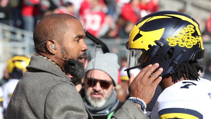 Former Michigan star Charles Woodson (left) talks with current Michigan running back Donovan Edwards during warmups before the game Nov. 26, 2022 against Ohio State at Ohio Stadium in Columbus.

Michohio 112622 Kd 584