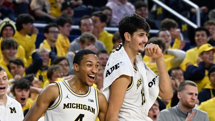 Nov 3, 2025; Ann Arbor, Michigan, USA; Michigan Wolverines guard Nimari Burnett (4) and center Aday Mara (15) celebrate on the bench in the final moments of their 121-78 win over the Oakland Golden Grizzlies at Crisler Center. Mandatory Credit: Lon Horwedel-Imagn Images Nov 3, 2025; Ann Arbor, Michigan, USA; Michigan Wolverines guard Nimari Burnett (4) and center Aday Mara (15) celebrate on the bench in the final moments of their 121-78 win over the Oakland Golden Grizzlies at Crisler Center. Mandatory Credit: Lon Horwedel-Imagn Images