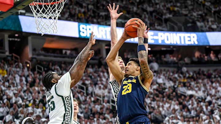 Michigan State's Coen Carr, left, and Carson Cooper, center, guard Michigan's Yaxel Lendeborg during the first half on Friday, Jan. 30, 2026, at the Breslin Center in East Lansing. Michigan State's Coen Carr, left, and Carson Cooper, center, guard Michigan's Yaxel Lendeborg during the first half on Friday, Jan. 30, 2026, at the Breslin Center in East Lansing.