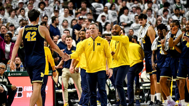 Michigan's head coach Dusty May, right, slaps hands with Will Tschetter during the second half in the game against Michigan State on Friday, Jan. 30, 2026, at the Breslin Center in East Lansing. Michigan's head coach Dusty May, right, slaps hands with Will Tschetter during the second half in the game against Michigan State on Friday, Jan. 30, 2026, at the Breslin Center in East Lansing.