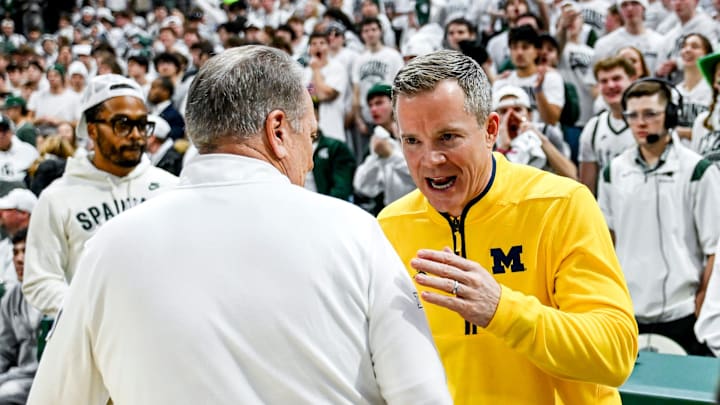 Michigan State's head coach Tom Izzo, left, and Michigan's head coach Dusty May meet before the game on Friday, Jan. 30, 2026, at the Breslin Center in East Lansing.