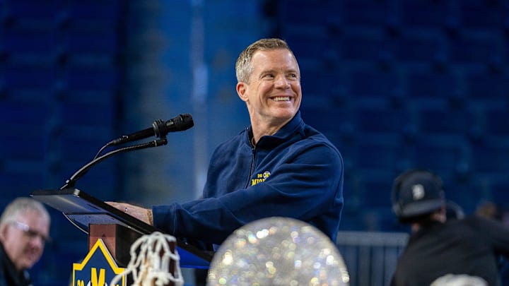 Michigan head coach Dusty May smiles at the podium during a celebration honoring the Wolverines’ NCAA men’s basketball national championship at Crisler Center in Ann Arbor on Saturday, April 11, 2026.