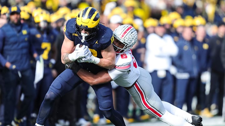 Michigan tight end Colston Loveland runs against Ohio State safety Sonny Styles during the first
