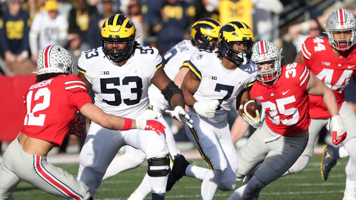 Michigan Wolverines running back Donovan Edwards (7) runs as lineman Trente Jones (53) blocks vs. the Ohio State Buckeyes during the second half at Ohio Stadium in Columbus, Saturday, Nov. 26, 2022.

Michohio 112622 Kd 7733