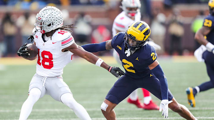 Michigan defensive back Will Johnson defends Ohio State receiver Marvin Harrison Jr. during the second half at Michigan Stadium in Ann Arbor on Saturday, Nov. 25, 2023.