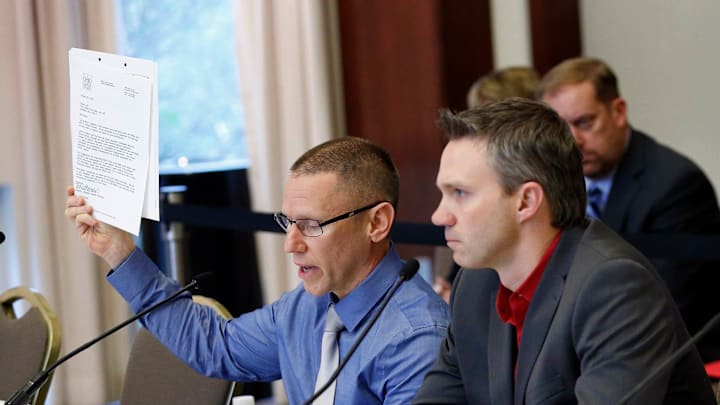 Victims of Dr. Richard Strauss, Brian Garrett, right, listens as Stephen Snyder Hill holds a document from Student Health Services while testifying to the extent of their abuse during an Ohio State University Board of Trustees meeting at the Longaberger Alumni House on Nov. 16, 2018.

Mt Trustees Ac 10