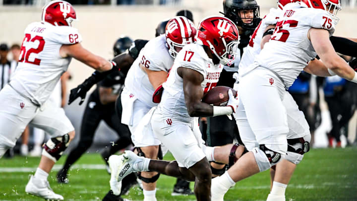 Indiana's Ty Son Lawton runs for a gain against Michigan State during the third quarter on Saturday, Nov. 2, 2024, at Spartan Stadium in East Lansing.