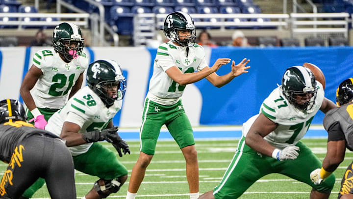 Detroit Cass Tech freshman quarterback Donald Tabron II calls for a snap against Detroit King during the first half of PSL championship at Ford Field in Detroit on Friday, Oct. 18, 2024. Offensive linemen Joshua Paramore (77) and Evan Gooden (58) prepare to block.