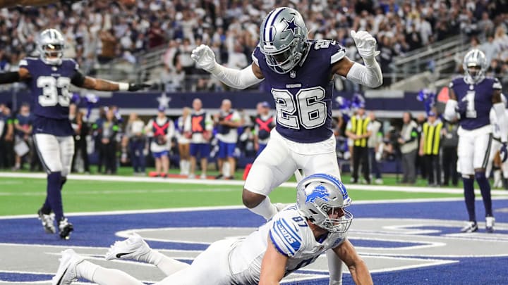 Lions tight end Sam LaPorta misses a catch in the end zone against Cowboys cornerback DaRon Bland during the first half at AT&T Stadium in Arlington, Texas on Saturday, Dec. 30, 2023.