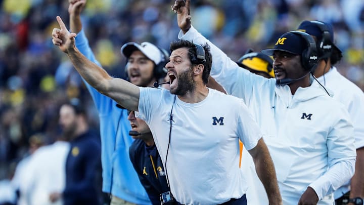 Michigan linebacker coach George Helow reacts to a play against Rutgers during the second half at