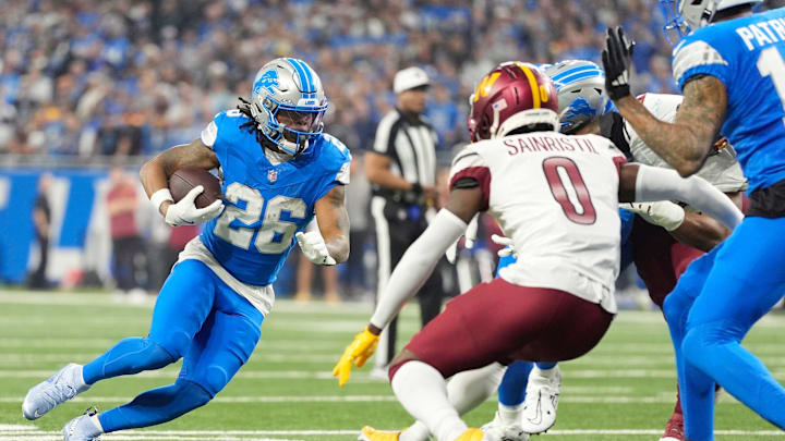 Detroit Lions running back Jahmyr Gibbs (26) runs the ball in the first quarter against the Washington Commanders in the NFC divisional round at Ford Field in Detroit on Saturday, Jan. 18, 2025.