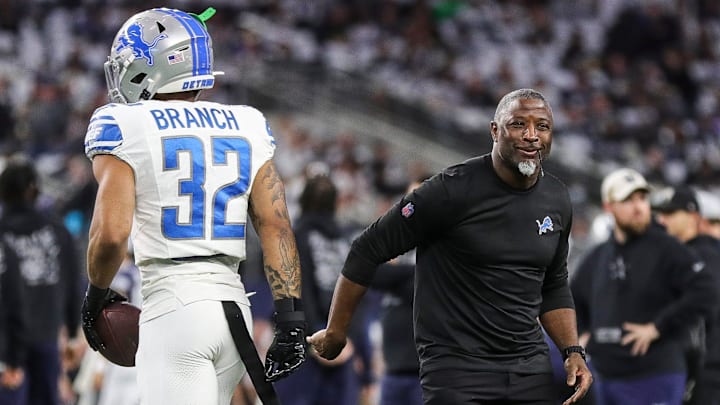 Detroit Lions defensive coordinator Aaron Glenn shakes hands with safety Brian Branch before the Dallas Cowboys game at AT&T Stadium in Arlington, Texas on Saturday, Dec. 30, 2023.