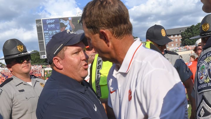 Sep 9, 2023; Clemson, South Carolina, USA;  Charleston Southern head coach Gabe Giardina and Clemson head coach Dabo Swinney shake hands after the game with Charleston Southern at Memorial Stadium. Mandatory Credit: Ken Ruinard-Imagn Images