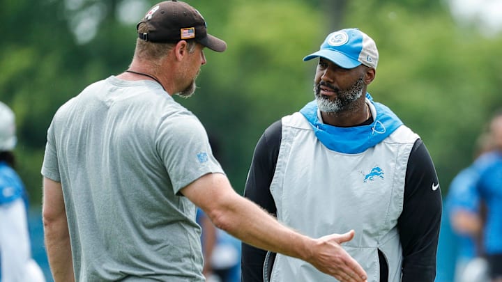 Detroit Lions head coach Dan Campbell, left, talks to general manager Brad Holmes during minicamp at Detroit Lions Headquarters and Training Facility in Allen Park on Tuesday, June 6, 2023.