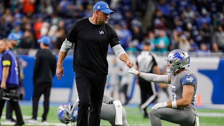 Detroit Lions head coach Dan Campbell fist bumps receiver Tom Kennedy during warmups before the game vs. the Miami Dolphins at Ford Field in Detroit on Sunday, Oct. 30, 2022.