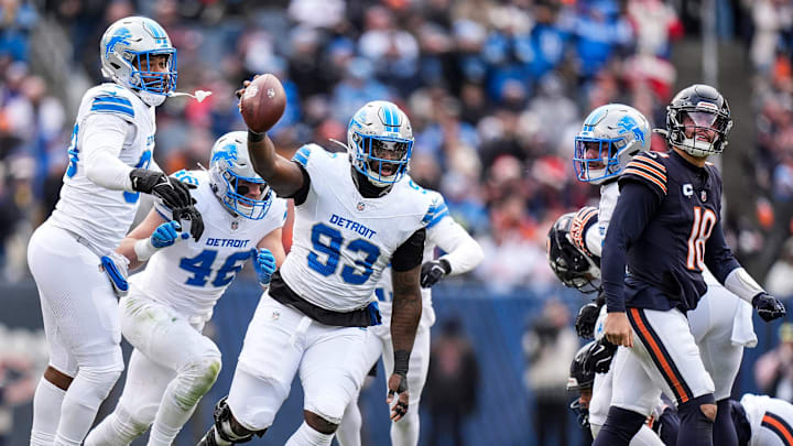 Detroit Lions defensive end Josh Paschal (93) celebrates a fumble recovery against Chicago Bears during the first half at Soldier Field in Chicago, Ill. on Sunday, Dec. 22, 2024. Detroit Lions defensive end Josh Paschal (93) celebrates a fumble recovery against Chicago Bears during the first half at Soldier Field in Chicago, Ill. on Sunday, Dec. 22, 2024.