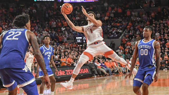 Dec 3, 2024; Clemson, South Carolina, USA; Clemson guard Chase Hunter (1) shoots near Kentucky center Amari Williams (22) and Kentucky guard Otega Oweh (00) during the second half at Littlejohn Coliseum.   Mandatory Credit: Ken Ruinard/USA TODAY Network via Imagn Images