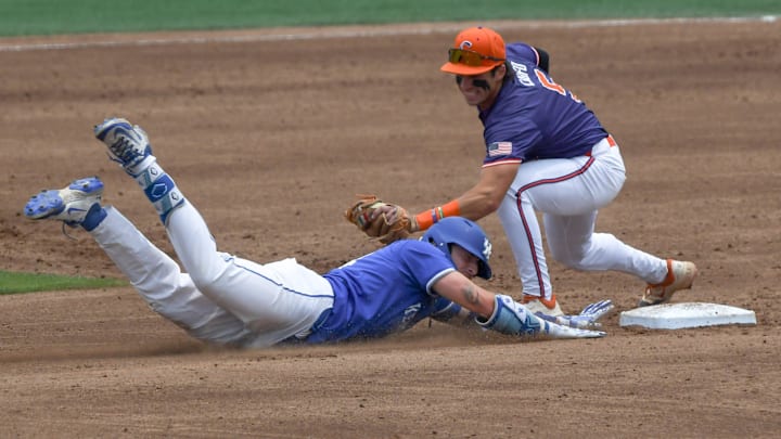 University of Kentucky junior Carson Hansen (34) beats the tag by Clemson infielder Andrew Ciufo (5) during the bottom of the third inning at the NCAA baseball Clemson Regional at Doug Kingsmore Stadium in Clemson, S.C. Sunday, June 1, 2025.