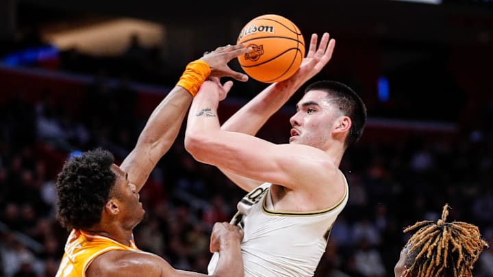 Purdue center Zach Edey (15) makes a jump shot against Tennessee forward Tobe Awaka (11) during the first half of the NCAA tournament Midwest Regional Elite 8 round at Little Caesars Arena in Detroit on Sunday, March 31, 2024.