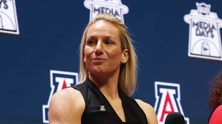 Oct 21, 2025; Kansas City, MO, USA; Arizona head coach Becky Burke speaks to media during Big 12 Womenís Basketball Media Day at T-Mobile Center. Mandatory Credit: Sophia Scheller-Imagn Images Oct 21, 2025; Kansas City, MO, USA; Arizona head coach Becky Burke speaks to media during Big 12 Womenís Basketball Media Day at T-Mobile Center. Mandatory Credit: Sophia Scheller-Imagn Images