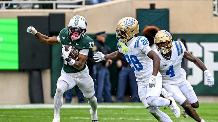 Michigan State's Chrishon McCray, left, runs after a catch as UCLA's Scooter Jackson closes in during the fourth quarter on Saturday, Oct. 11, 2025, at Spartan Stadium in East Lansing.