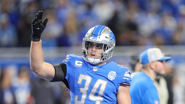 Lions linebacker Alex Anzalone wave at fans during warmups before the NFC wild-card game at Ford