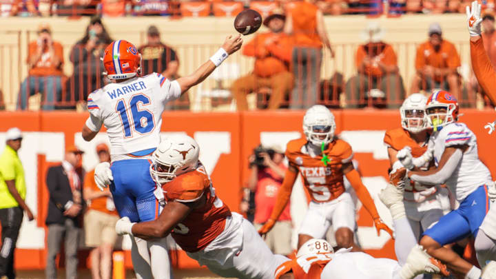 Texas Longhorns defensive lineman Alfred Collins (95) attempts to tackle Florida Gators quarterback Aidan Warner (16) during the Longhorns' game against the Florida Gators, Nov. 9, 2024 at Darrell K. Royal Texas Memorial Stadium in Austin.