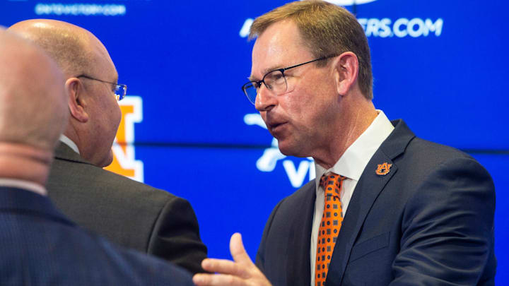 Auburn athletic director John Cohen and Auburn University President Chris Roberts talk during an