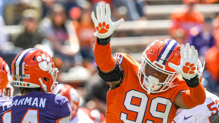 Clemson defensive end A.J. Hoffler (99) pressures Clemson quarterback Trent Pearman (14) during the Spring football game in Clemson, S.C. Saturday, April 6, 2024.