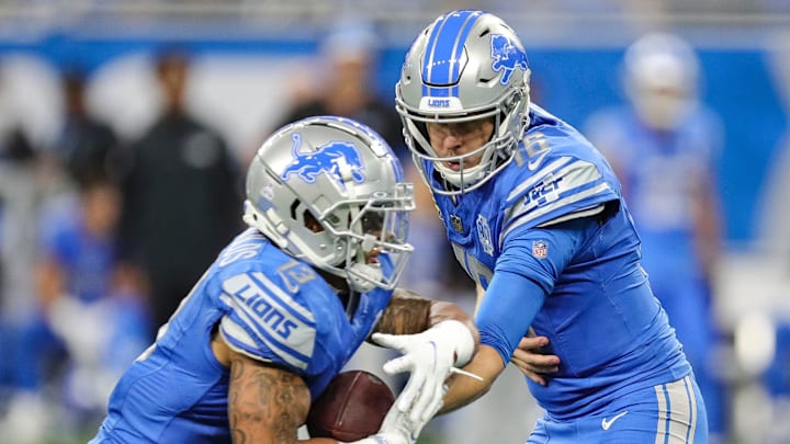 Lions quarterback Jared Goff hands the ball to running back Craig Reynolds during the second half of
