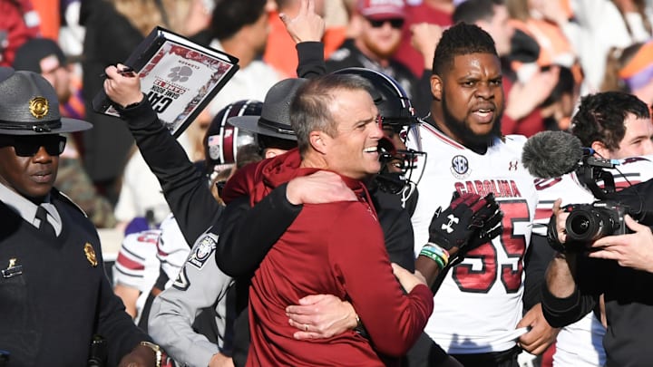 Nov 30, 2024; Clemson, South Carolina, USA; Clemson head coach Dabo Swinney and South Carolina Head Coach Shane Beamer talk after the game at Memorial Stadium. Mandatory Credit: Ken Ruinard-Imagn Images
