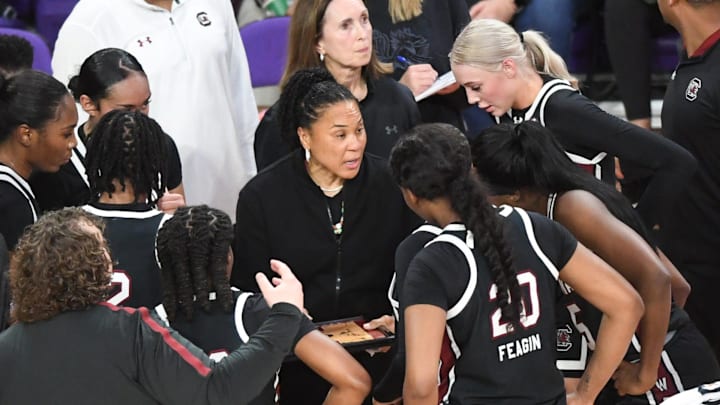 South Carolina Coach Dawn Staley talks with players in a break from playing Clemson during the second quarter at Littlejohn Coliseum Wednesday, Nov. 20, 2024 in Clemson, SC.