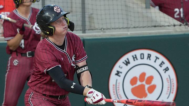 South Carolina senior Jamie Mackay (20) hits a home run against Clemson during the top of the seventh inning at McWhorter Stadium in Clemson Tuesday, April 14, 2026.