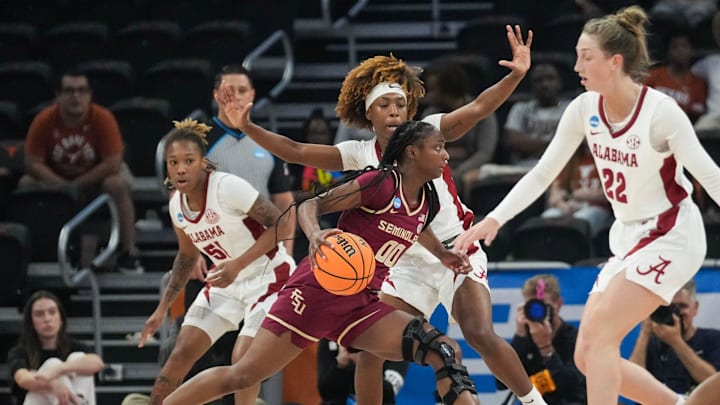 Florida State Seminoles guard Ta'Niya Latson (00) dribbles toward the basket as Alabama takes on Florida State in round one of the NCAA women's basketball tournament at the Moody Center in Austin Friday, March 22, 2024.