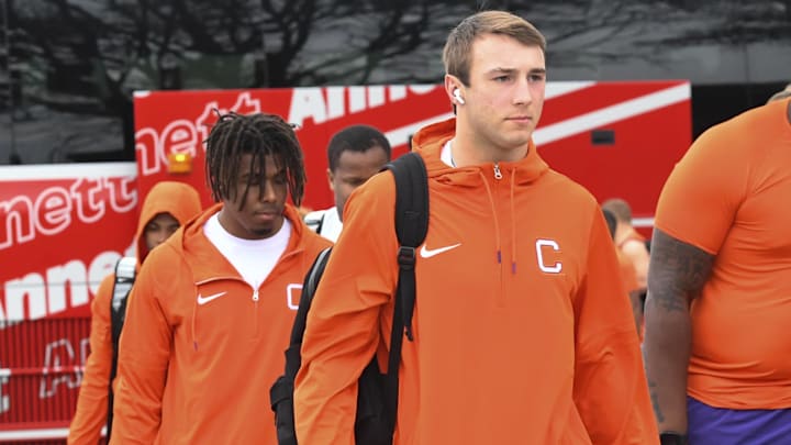 Clemson quarterback Cade Klubnik (2) arrives with the team before football team practice.
