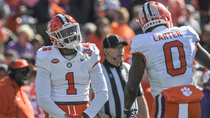 Clemson safety Jalyn Phillips (1) reacts after Barrett Carter sacked Kentucky quarterback Devin Leary.