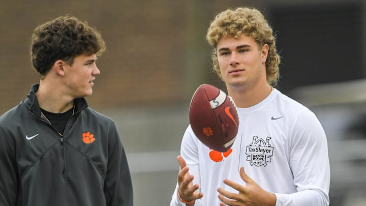 Drew Woodaz, left, and Sammy Brown, signees, watch Clemson football team practice