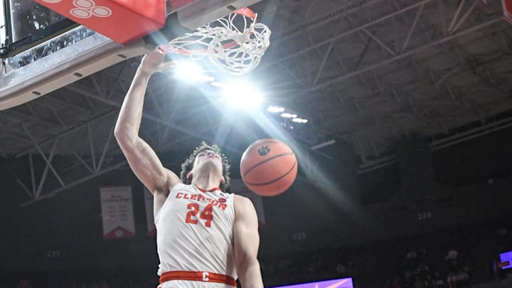 Feb 14, 2024; Clemson, South Carolina, USA;  Clemson junior forward PJ Hall (24) dunks near Miami