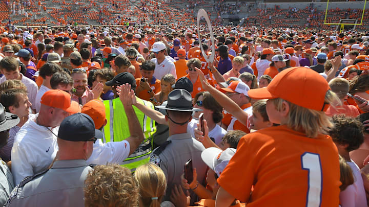 Sep 21, 2024; Clemson, South Carolina, USA; Clemson Tigers fans celebrate after the programs 800th victory after defeating the North Carolina State Wolfpack at Memorial Stadium. Mandatory Credit: Ken Ruinard-Imagn Images
