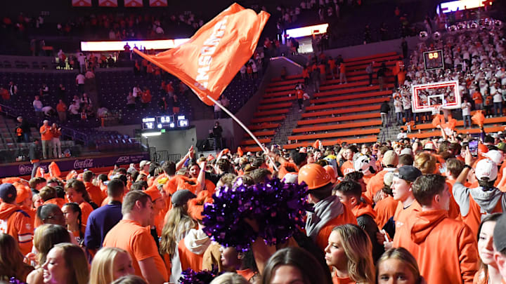 Dec 30, 2022; Clemson, South Carolina, USA; Clemson fans celebrate with players after the Tigers beat Duke 72-64 at Littlejohn Coliseum. Mandatory Credit: Ken Ruinard-Imagn Images