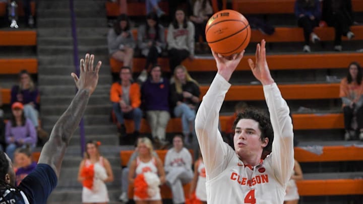 Clemson senior forward Ian Schieffelin (4) scores near Radford forward Josiah Harris (5) during the second half at Littlejohn Coliseum Thursday, November 21, 2024; Clemson, SC, USA.